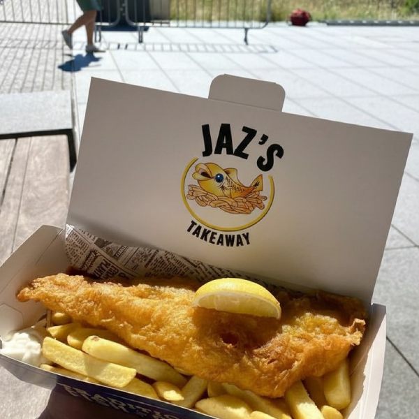 A box of fish and chips with a lemon wedge from Jaz's Takeaway in Crossgates